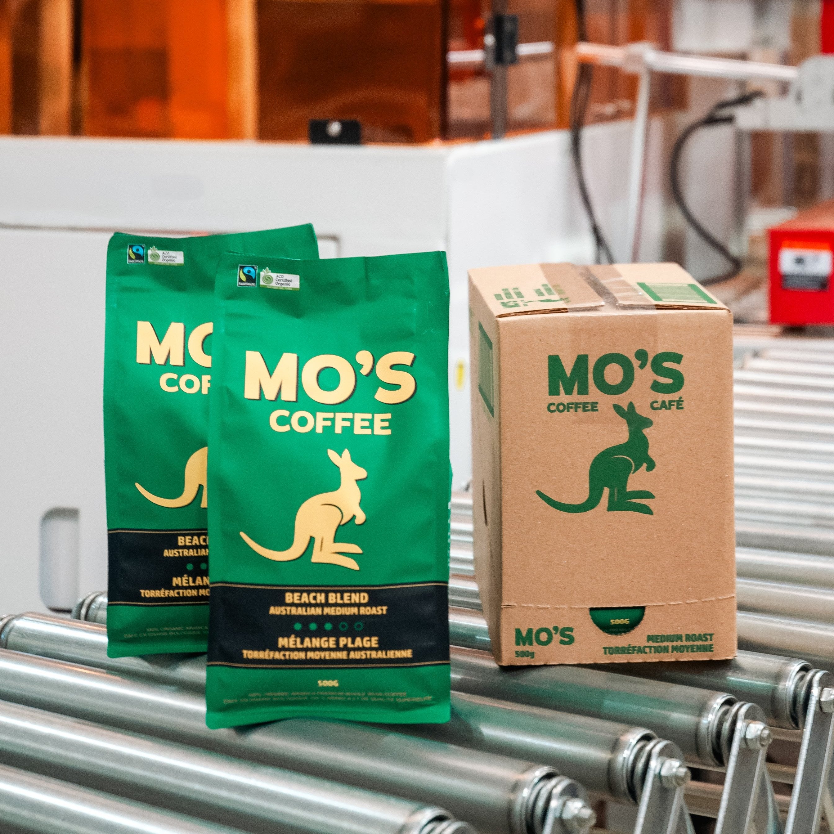 MO'S Coffee on assembly line being packed into carton cases. 